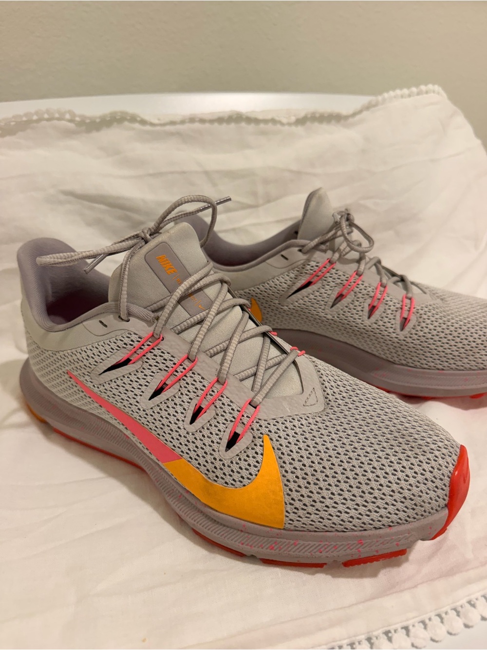 Nike Women’s Light Gray Running Shoes with Yellow & Pink Accents